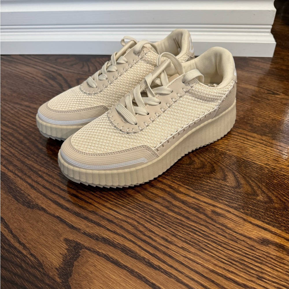 Beige slight platform sneaker. New condition. Size 7.
